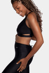 Aura7 Activewear crisscross malibu sports bra side profile with yoga pants